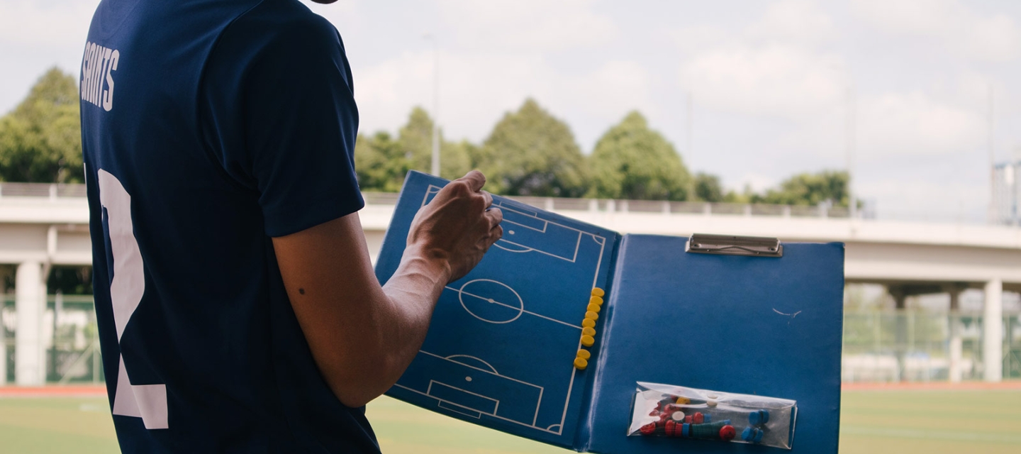 Coach with a clipboard